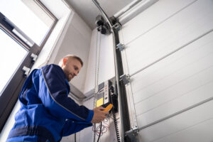 Garage,Door,Installation,And,Repair,At,Home.,Contractor,Man,In